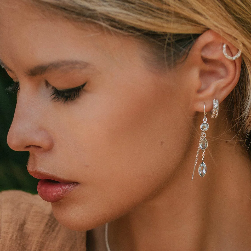 Women wears drop earrings